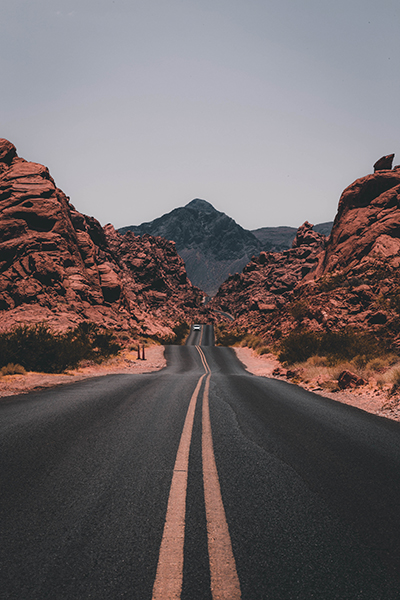 A long solitary road along mountains