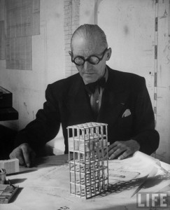 Le Corbusier with a model