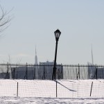 Midtown antennas and a crooked light in Central Park