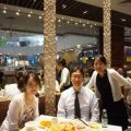 Rena Sung, her recommender, and another supervisor posing for a photo in a restaurant